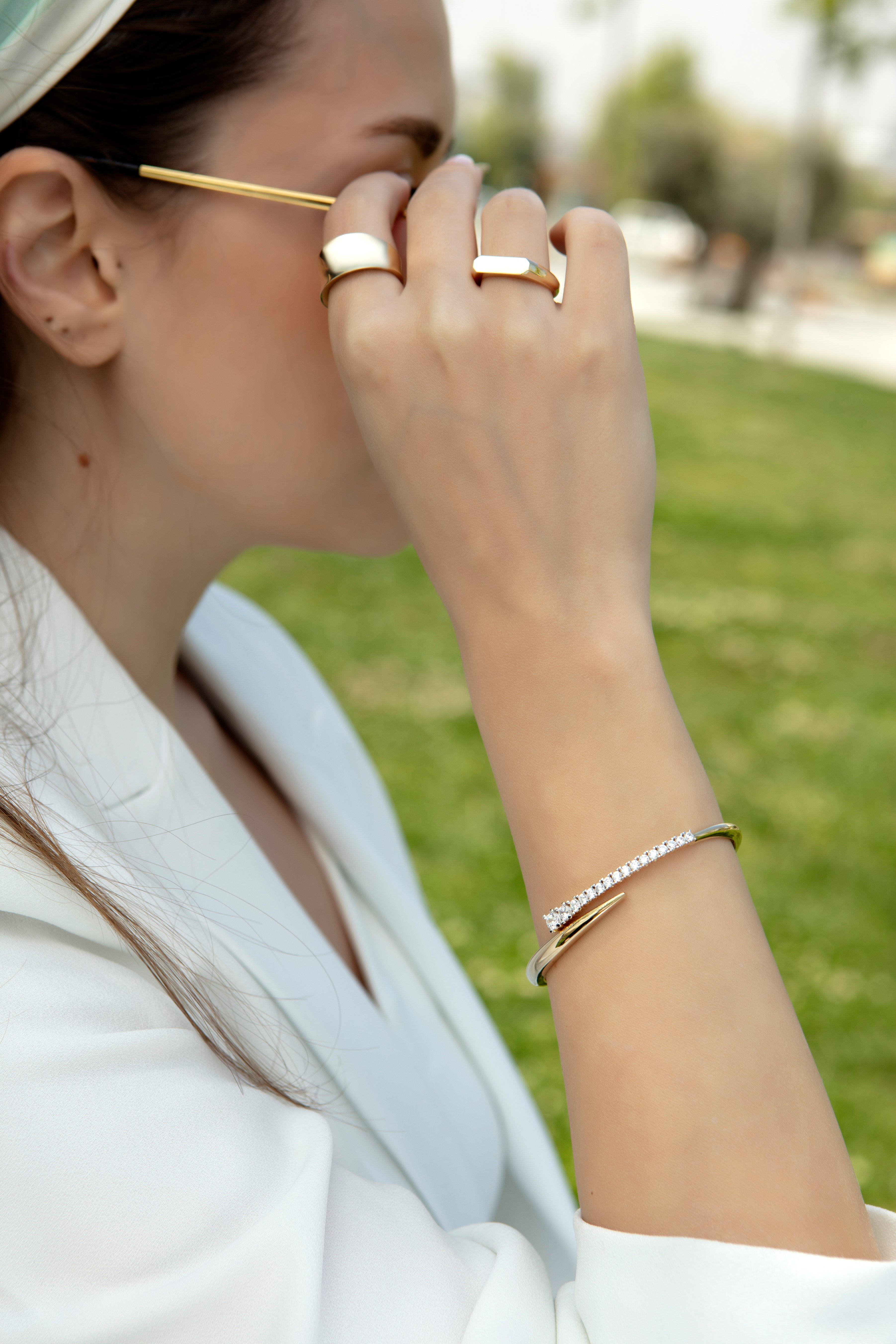 Graduated cubic zirconia bypass bangle in solid 14K & 18K gold — Kavseyn