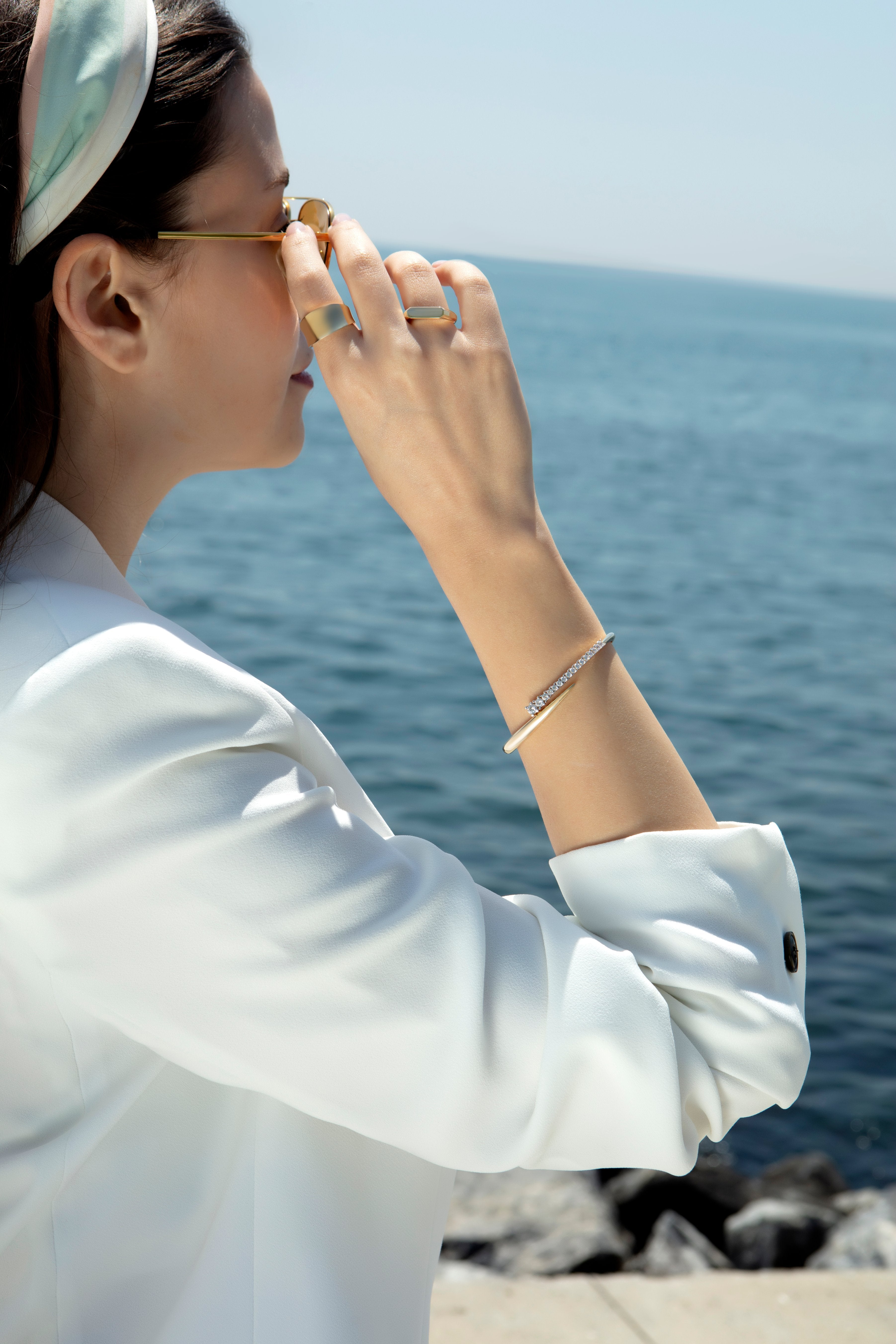 Graduated cubic zirconia bypass bangle in solid 14K & 18K gold — Kavseyn