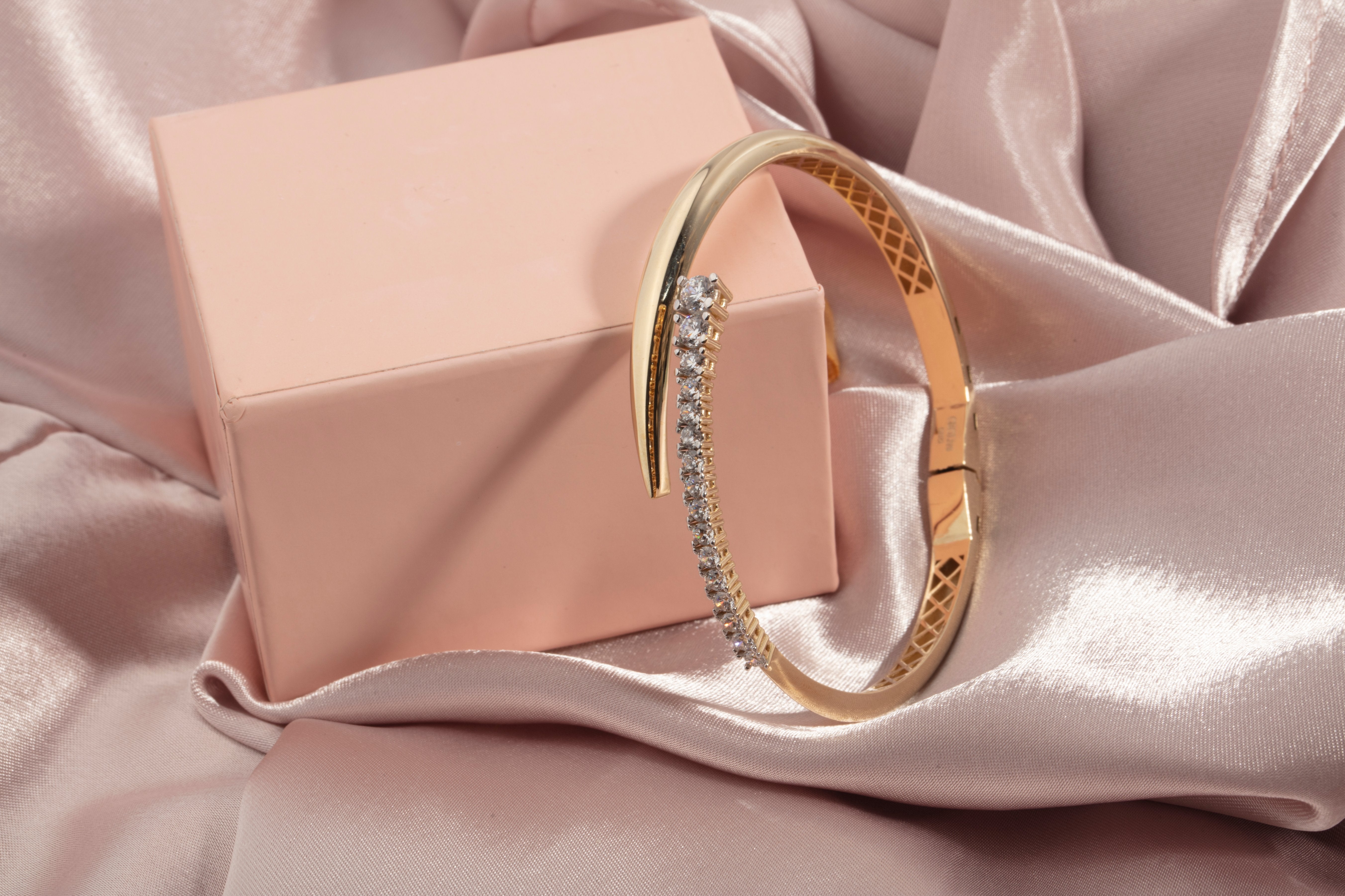 Graduated cubic zirconia bypass bangle in solid 14K & 18K gold — Kavseyn