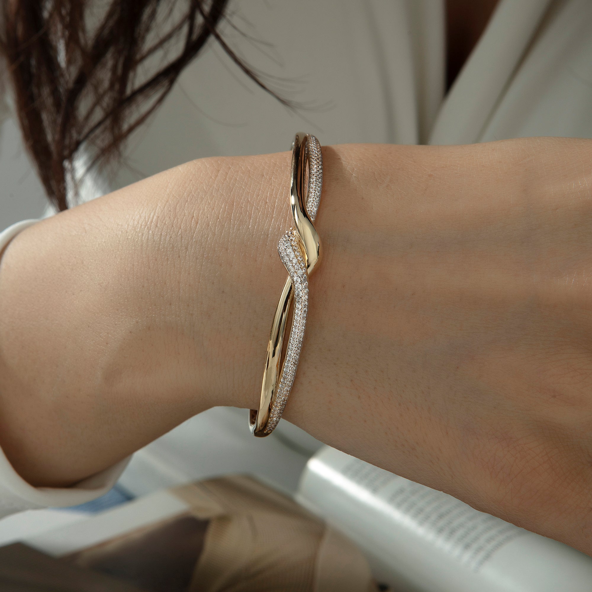 Pavé cubic zirconia twist bangle bracelet in solid 14K & 18K gold — Kavseyn