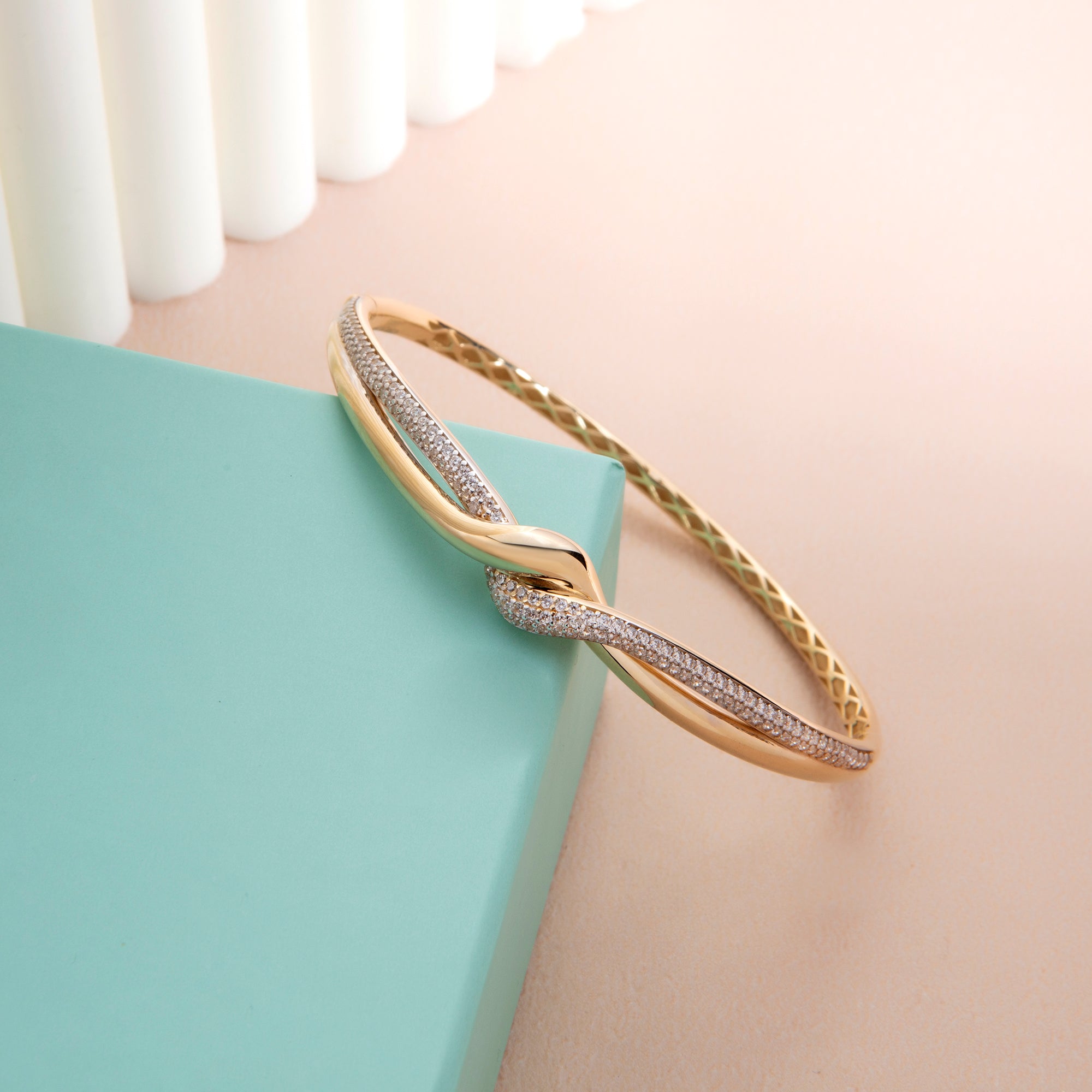 Pavé cubic zirconia twist bangle bracelet in solid 14K & 18K gold — Kavseyn